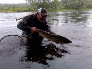 David Bishop from Cascapedia Quebec with one of 3 salmon he hooked