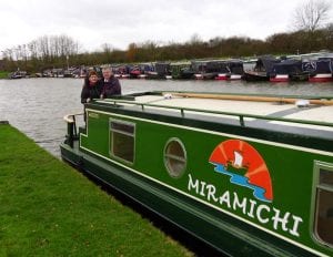 Bill Blanchard and wife aboard their narrowboat, Miramichi.