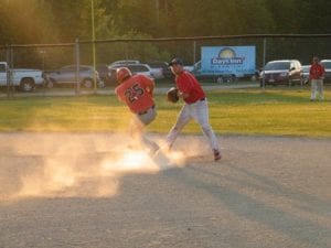 Eel Ground Eagles runner Blair Augustine makes it to second, despite the best efforts of the Nelson 'Days Inn' Red Sox and shortstop Jake Nicholson.