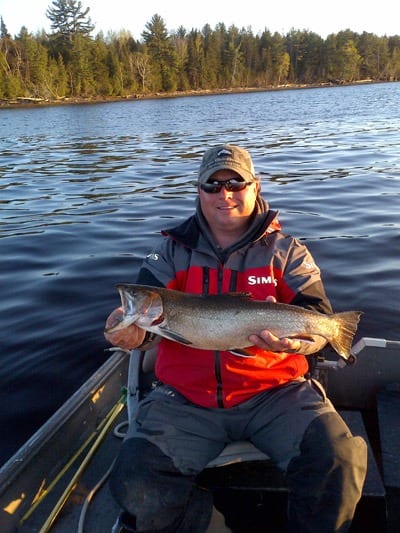 A trout landed by Derek Munn while fishing bass  23 inches long