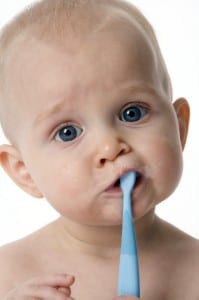 Baby with toothbrush