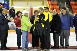 At the Miramichi Timberwolves Season Home Opener, Don Mac presents councillor Billy Flieger with a Mac's Seafood coat as a thank you for helping them out over the last year by getting them involved in the sports community. Photo by Greg MacDiarmid.
