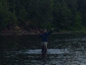 Mike Vorheof  is pretty happy into his first salmon. Photo by Derek Munn