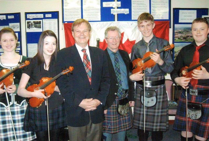 The Fochabers Fiddlers with John McKay, Past President of the Highland Society and James Alexander founder of the group. 