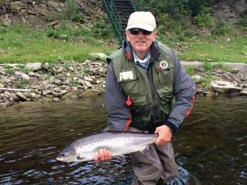 John McGuire with a nice fresh July salmon. Landed at one of Ledges pools on July 24th. 