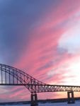 A colourful sunset behind the Centennial Bridge. Photo by Jean Joudry
