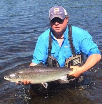 Derek Munn with a nice bright 20 pound salmon. 