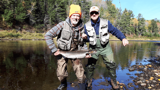 Tom Bishop from Saint John with a nice henwith a little help from TK Tonge caught on the Wangatang Pool at Milletts on the Cains on the last day of the season.