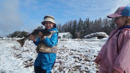 Young anglers with Jeff Morris catch and release a nice spring fish.