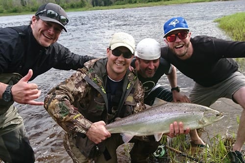 Jeff Morris with a nice bright salmon caught on the Northwest Miramichi